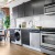 a kitchen with black cabinets