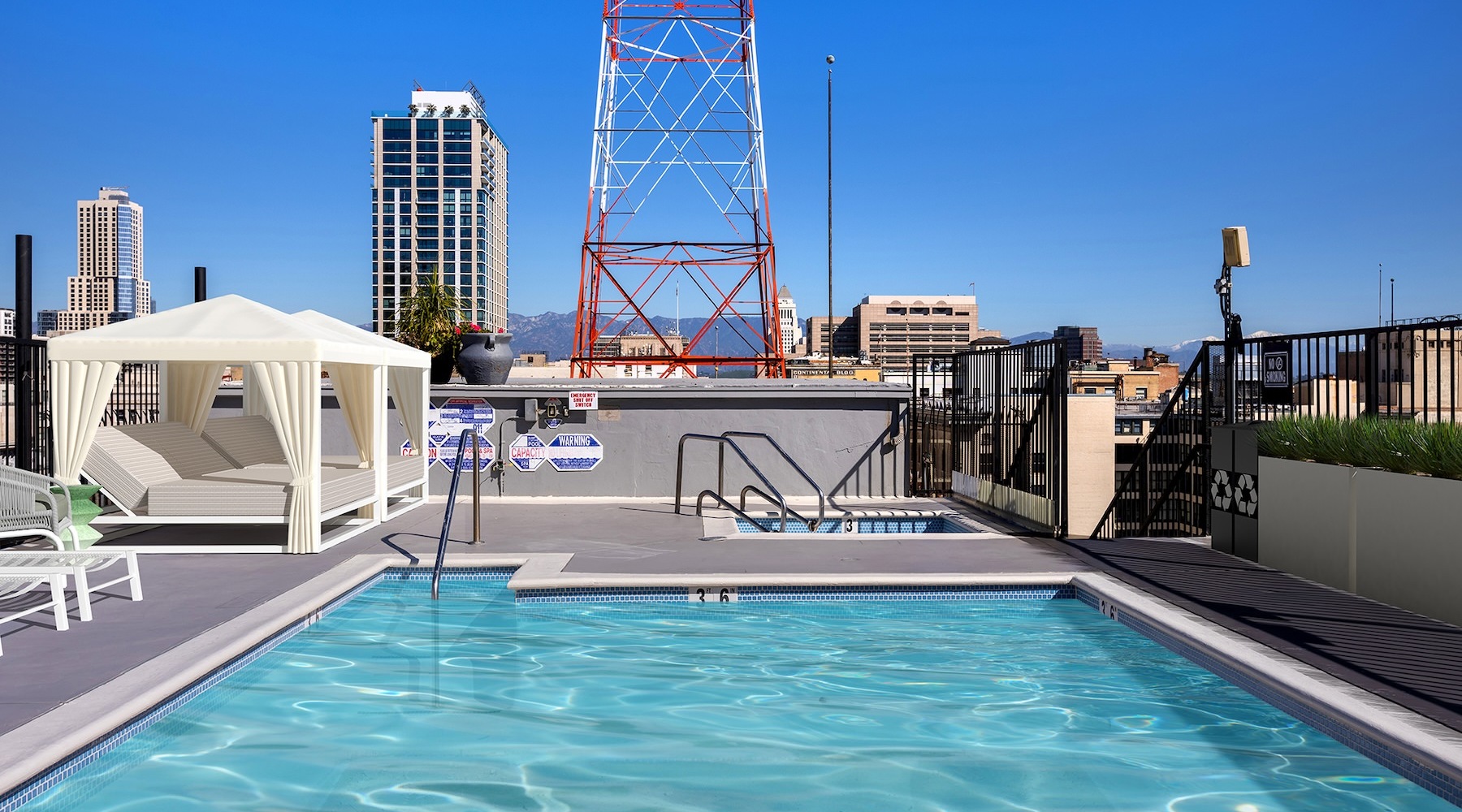 Resort-style swimming pool a rooftop pool with cabanas